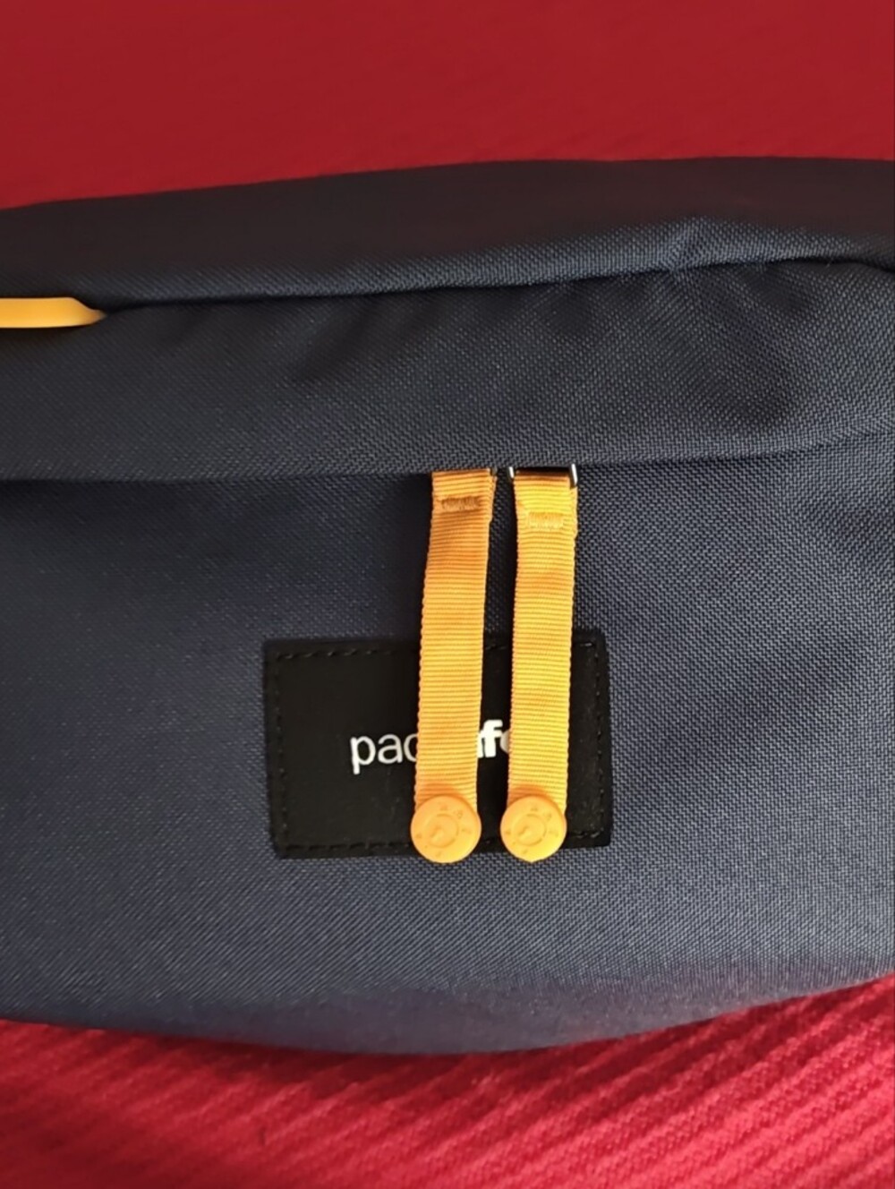 Pacsafe Navy Sling Bag with Yellow Accents